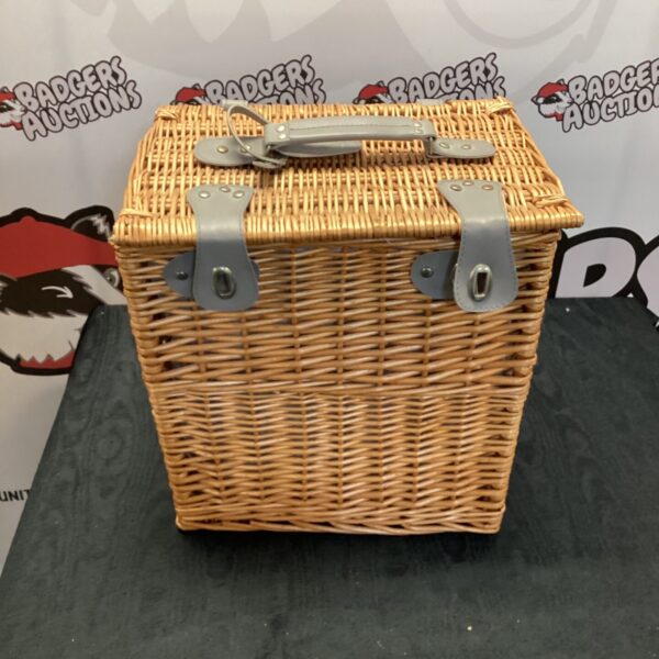 Front view of vintage Stella Artois wicker basket cooler.