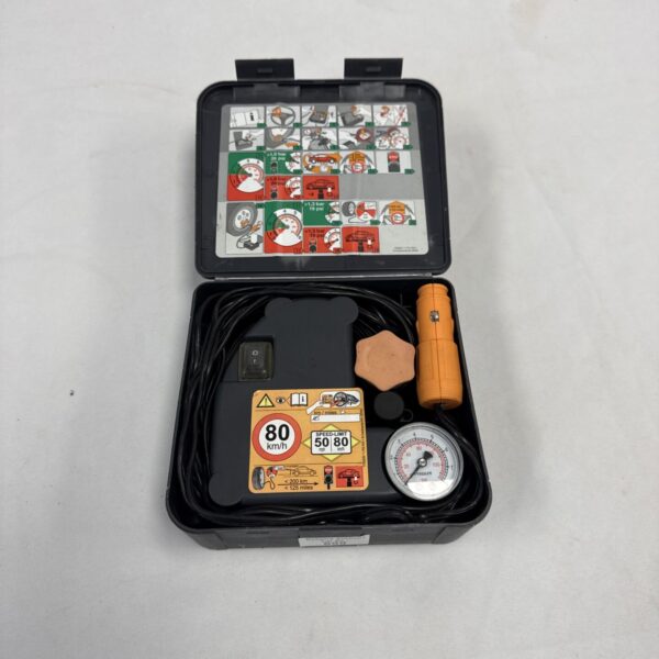 Continental 12v tyre inflator in a plastic case, showing the unit and hose.