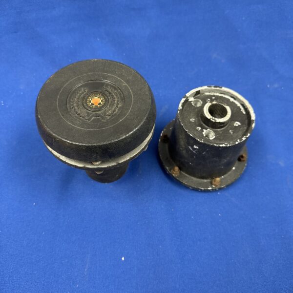 Vintage Jaguar steering wheel boss with horn button for classic cars.