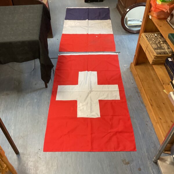 Large Switzerland flag with white cross on red background.