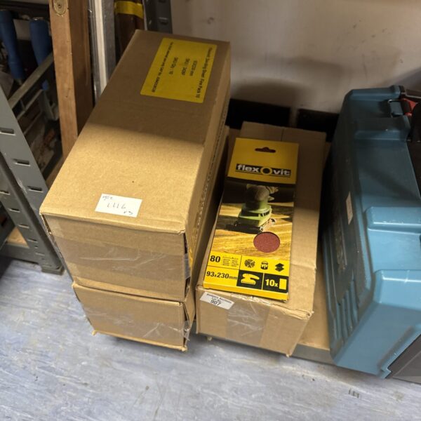 Three boxes of used Flexovit sanding pads for power tools.