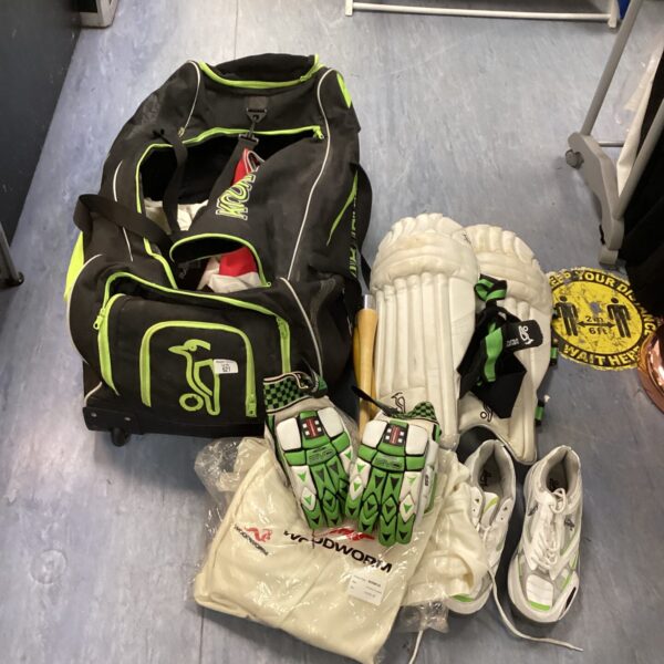 Kookaburra cricket bag with cricket kit and new Woodworm trousers.