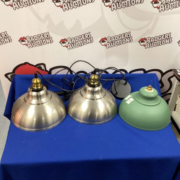 Three vintage hanging lights with conical shades.