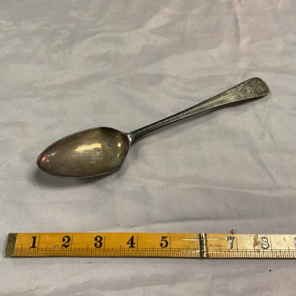 Antique Georgian silver dessert spoon with hallmarked handle.