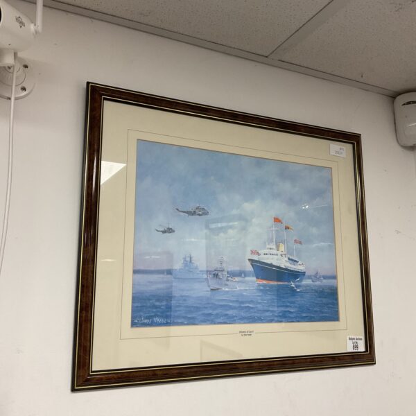 Framed Chris Woods print of Royal Yacht Britannia at sea.