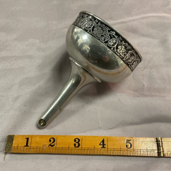 Vintage Royal Selangor pewter wine funnel with embossed details.