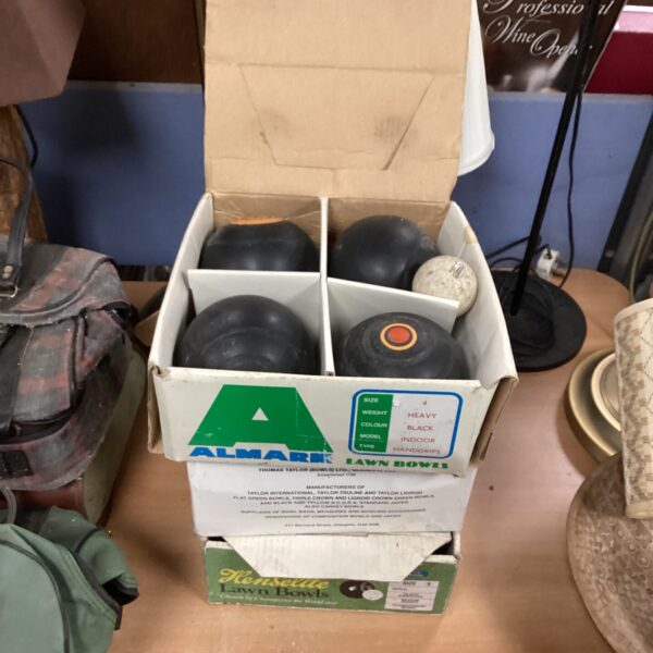 Henslite lawn bowls set in used condition for outdoor games.
