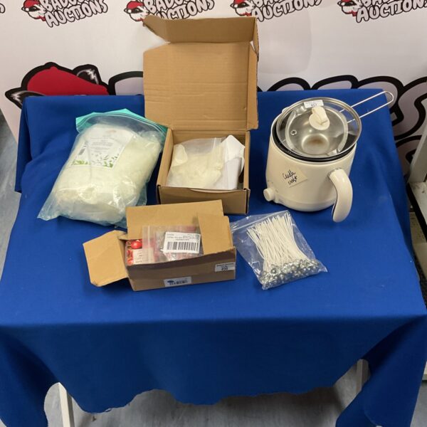 White wax melting pot with wax blocks for crafting.