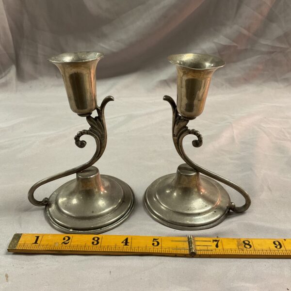 Vintage pair of Mexico silver candlesticks on ruler.