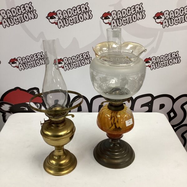 Pair of vintage paraffin lamps with brass and glass bases.