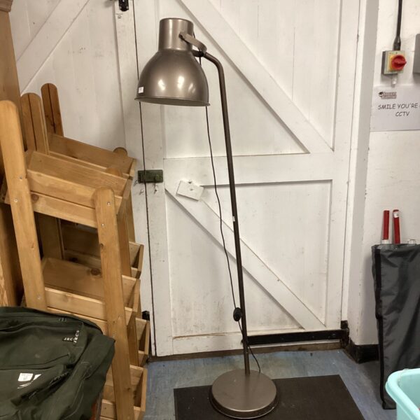 Vintage adjustable standard lamp with a metal shade and weighted base.