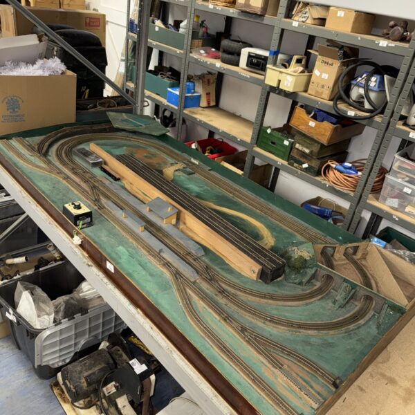 Overhead view of detailed N gauge model railway section with train.