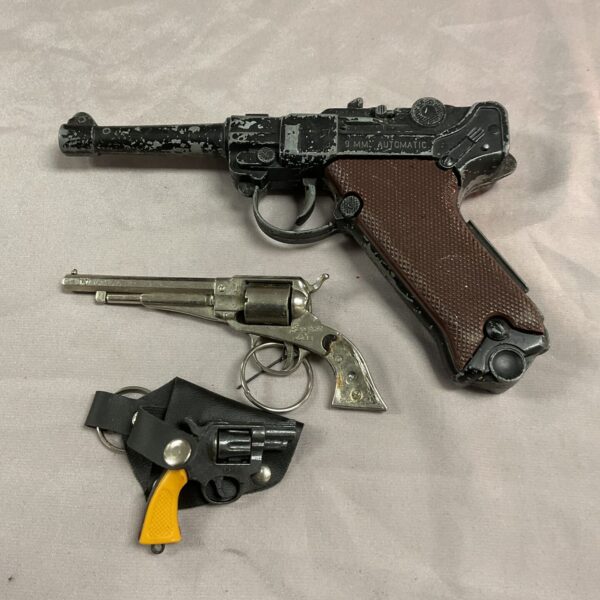 A lot of three vintage cap guns, including a Lone Star model.