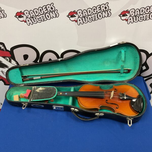 Lark violin in open case with bow, vintage stringed instrument.