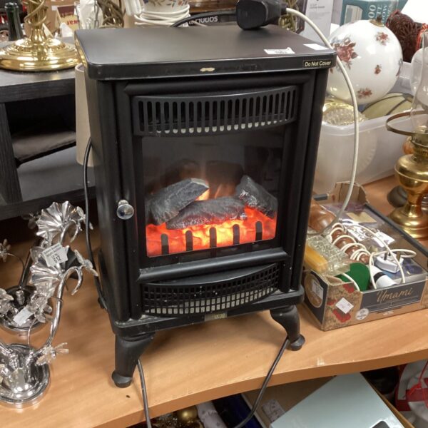 Electric heater stove with realistic flame effect for cozy warmth.