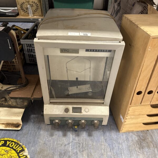 Front view of vintage Oertling precision scales in a laboratory setting.
