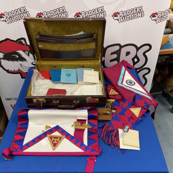 Vintage Masonic aprons and regalia collection in a carrying case.