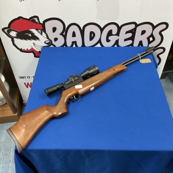 Weihrauch HW77 air rifle with Nikko Sterling scope, side view.