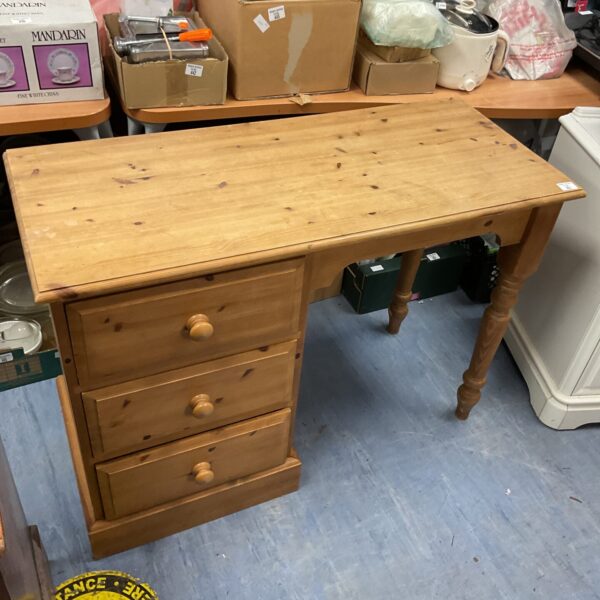 Vintage pine three drawer desk with wooden finish.