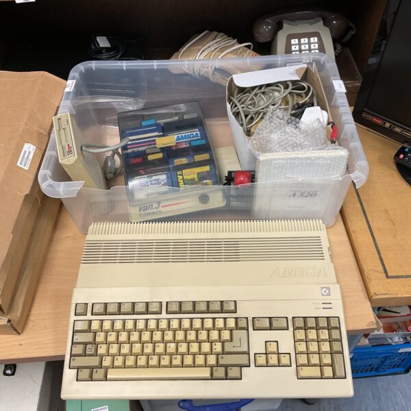 Vintage Commodore Amiga A500 computer with accessories.