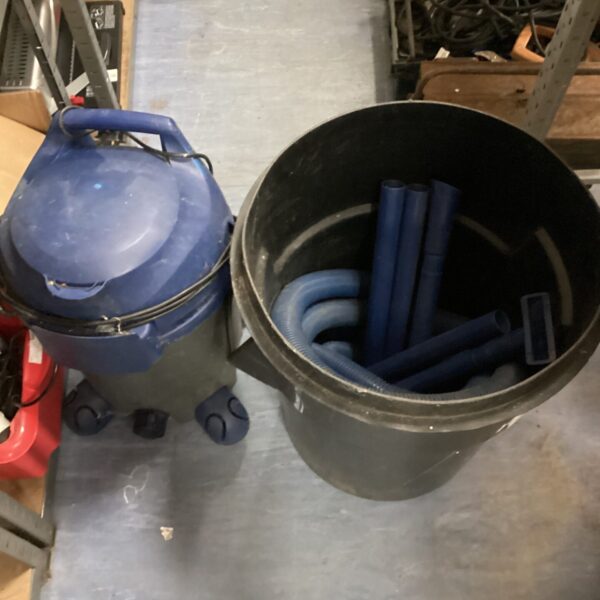 Large fish pond pump with bin of accessories for water garden.
