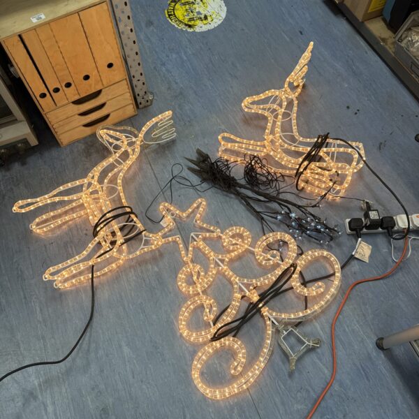 Illuminated reindeer Christmas light decoration for outdoor festive display.