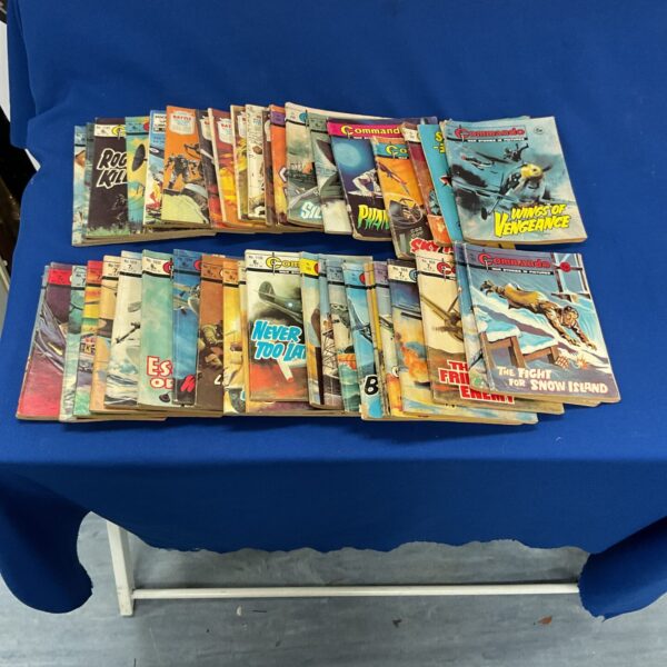 Stack of vintage Commando comics, British war comics collection.