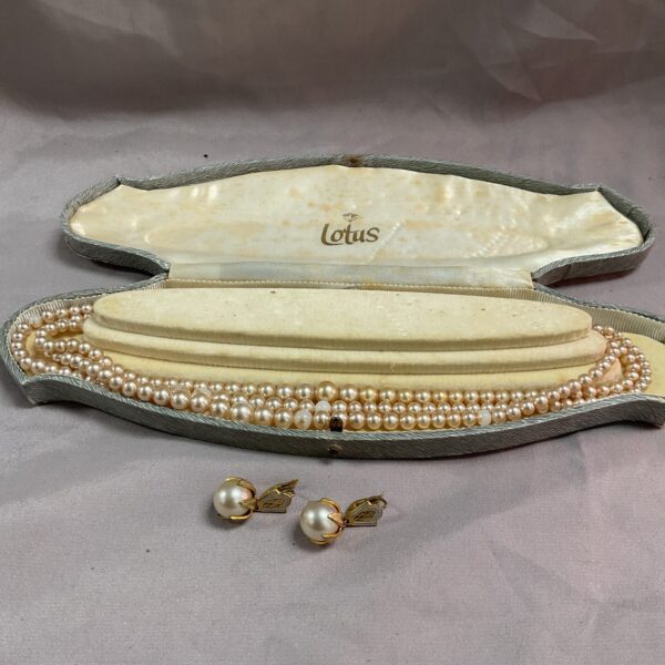 Vintage faux pearl necklace and Toledo clip-on earrings set displayed in box.