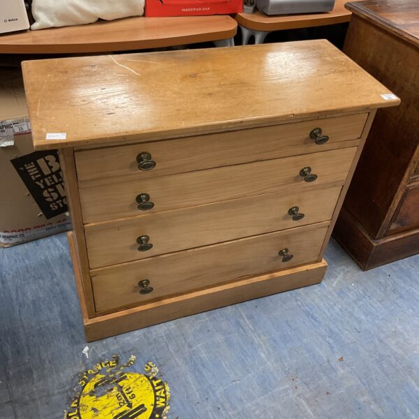Vintage light oak chest of drawers with four drawers.