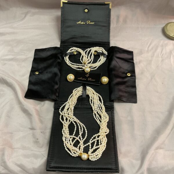 Vintage Andre Picasso faux pearl necklace and earring set displayed in box.