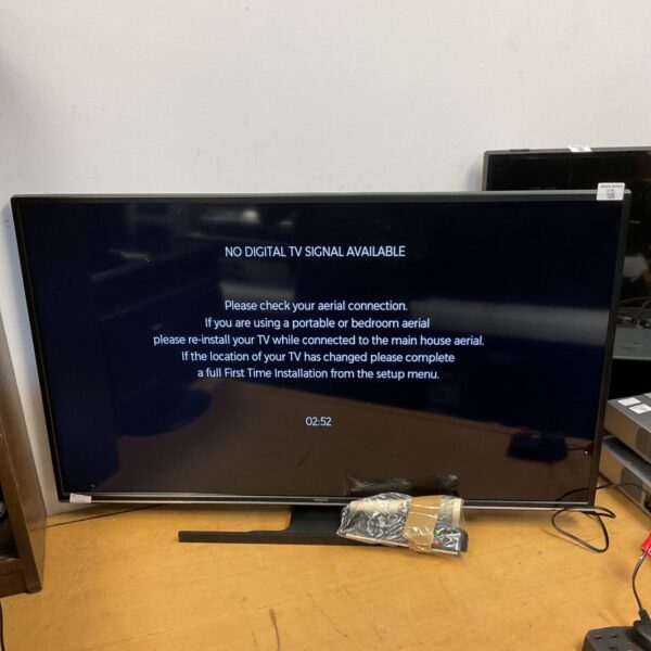Hitachi 43 inch HD television with remote control displayed.