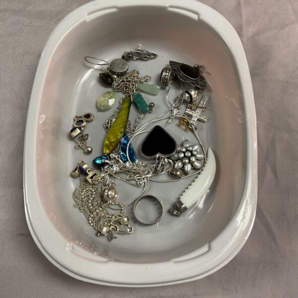 Tray of mixed costume jewellery with silver tone pieces.