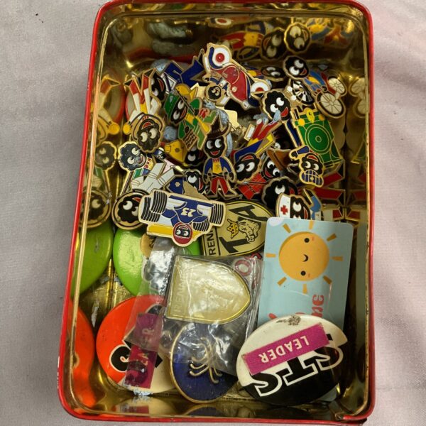 Vintage collection of enamel Golly badges and scout emblems.