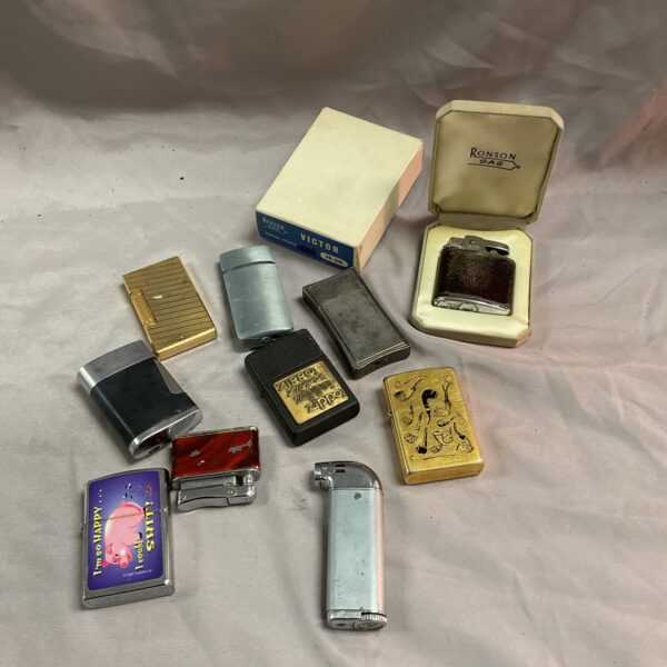 Vintage lighters collection including Zippo and Ronson brands.