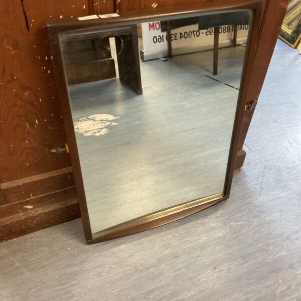 Vintage mahogany framed mirror with decorative knobs for wall display.