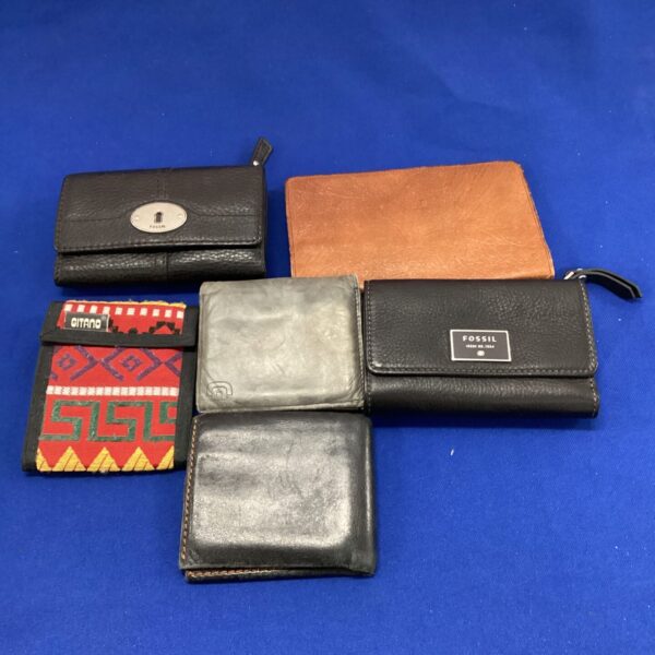Fossil wallet lot featuring leather wallets and purses.