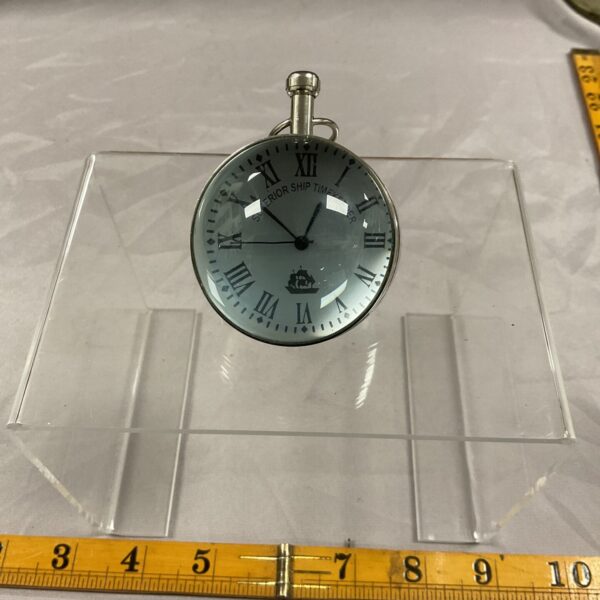 Front view of a Superior Ship Timekeeper desk clock with Roman numerals.