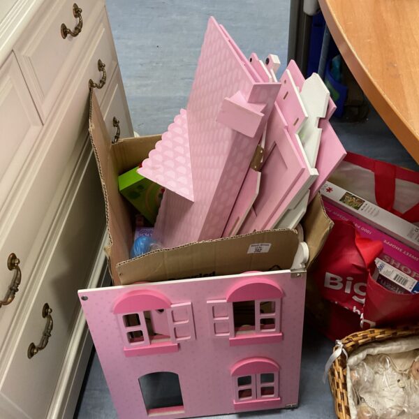 Pink wooden dolls house, vintage toy for imaginative play.