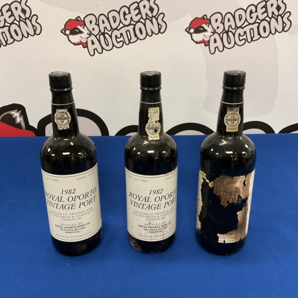 Three sealed bottles of 1982 Royal Oporto vintage port wine.
