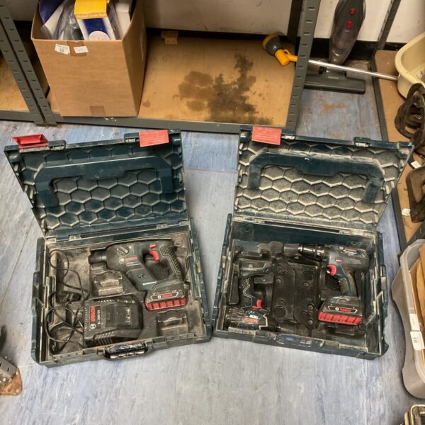 Bosch cordless drill set with impact driver in open case.