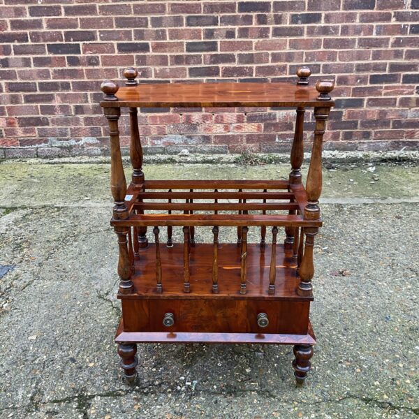 Antique burr walnut canterbury with drawer and spindle design.
