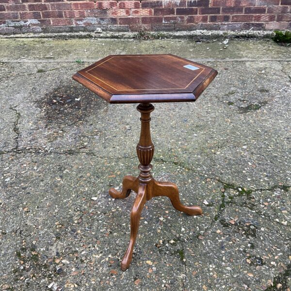 Antique oak hexagonal wine table with tripod legs.