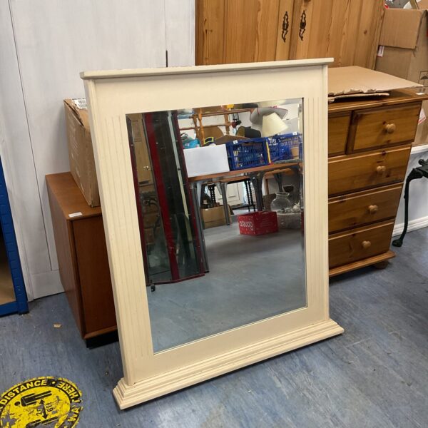 Large antique overmantle mirror with a bevelled edge and gilt finish.