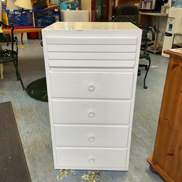 Vintage five-drawer wooden chest of drawers for bedroom storage.