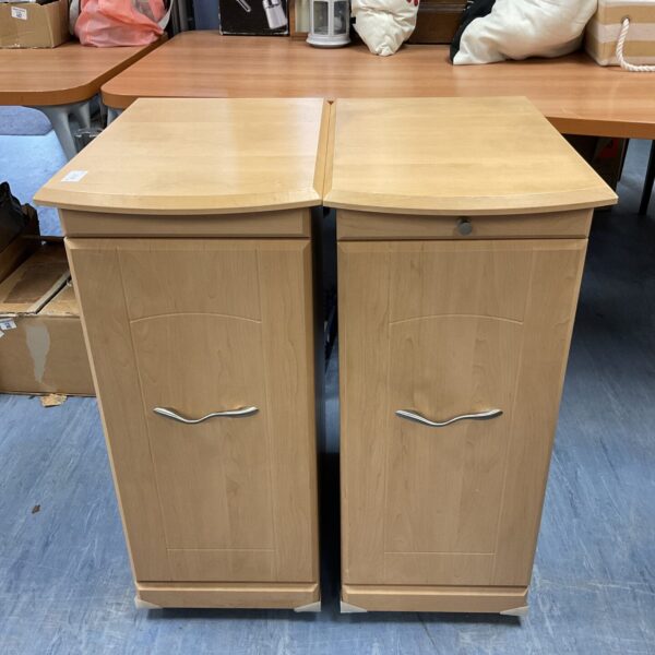 Pair of tall beech effect bedside cabinets for bedroom storage.