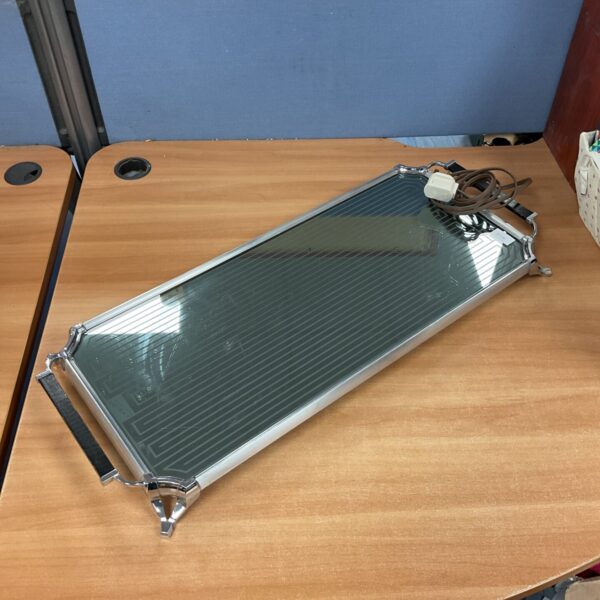 Vintage Salton hot tray food warmer with chrome surface.