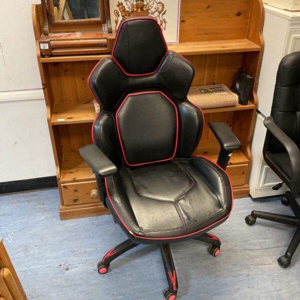 Black and red gaming chair for comfortable desk setup.
