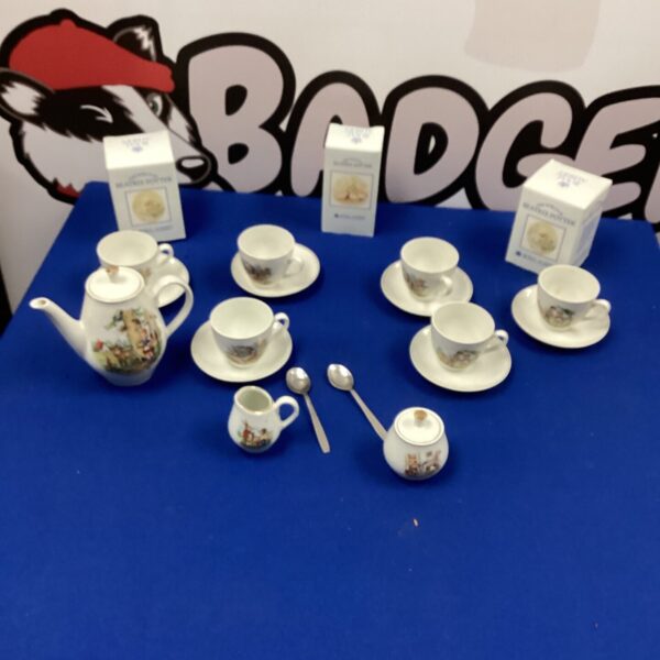 Vintage Royal Albert Beatrix Potter tea set with charming illustrations.