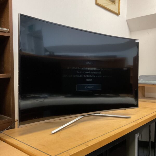 Samsung 49 inch curved 4K TV with a dim screen.