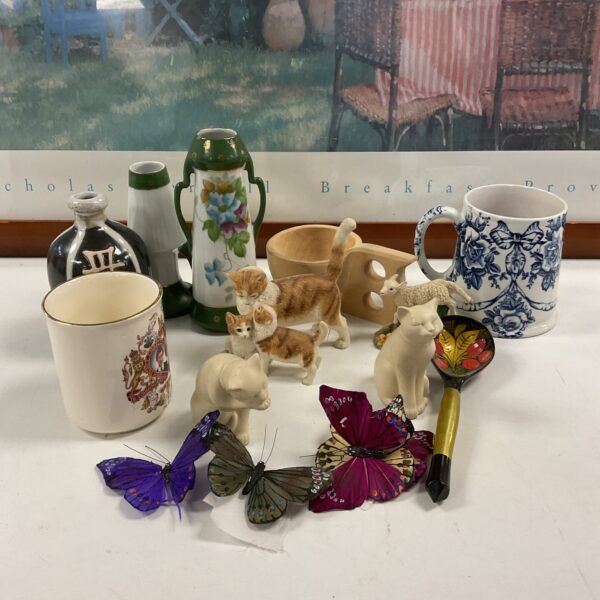 Mixed collectables lot featuring porcelain, figurines, and silk butterflies.